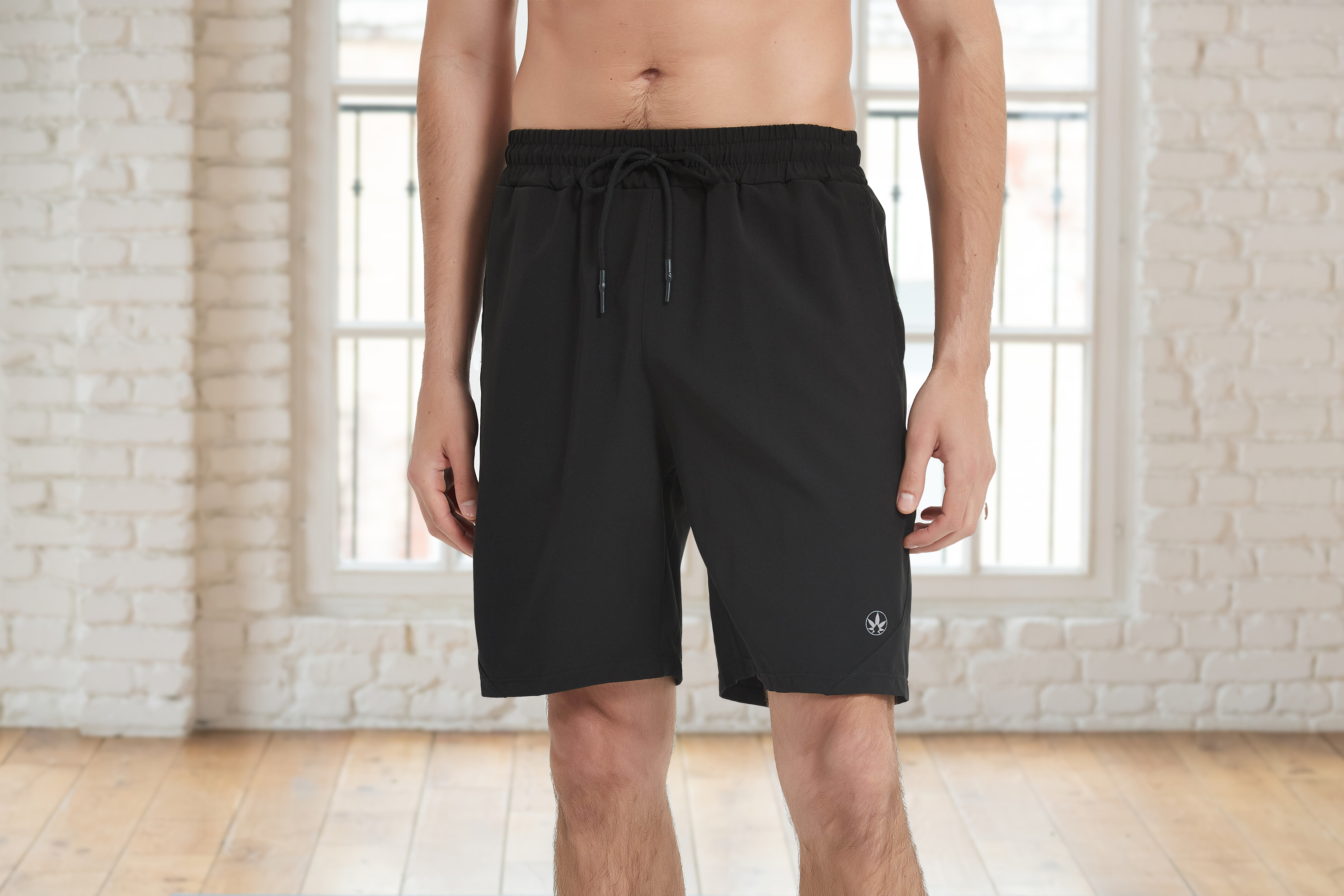 Amend Co. model wearing sustainable black shorts