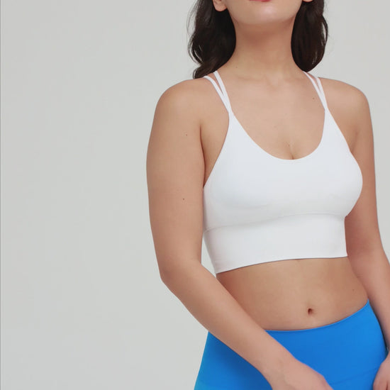 Amend Co. Female Model Wearing Eco-Friendly White Bra and Blue Leggings